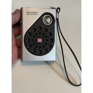 Vintage Sharp Solid State BP-160 Pocket AM Radio Silver With Strap ( Read Descri